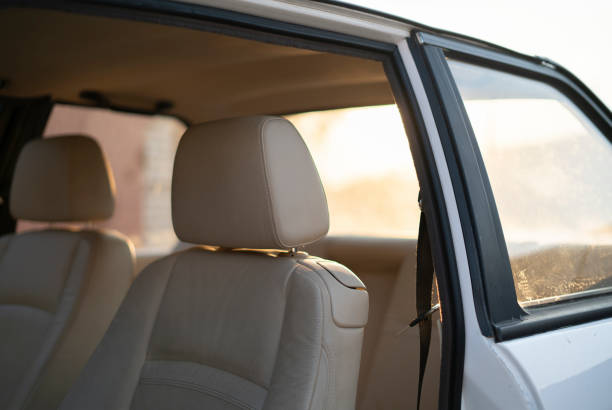 istock white leather car interior, inside the vintage old vehicle 1415573647
