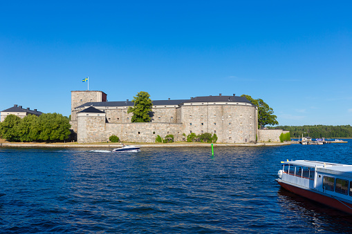 Vaxholm, Sweden - August 14, 2022: Vaxholm castle is a landmark for vessels on there way to Stockholm. The castle was built to protected Stockholm from invaders in the 1500s