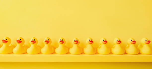istock Banner yellow rubber duck background yellow ducks in a row. Rubber duck pattern yellow concept. Communication. Community. Rubber ducky bath toy duckling bathroom shelf toy design shelf decor. Organize 1415574636