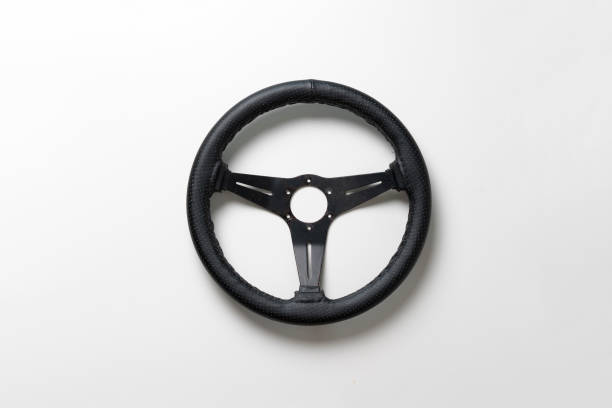 istock isolated car steering wheel on the flat surface, simple transportation concept 1415575501