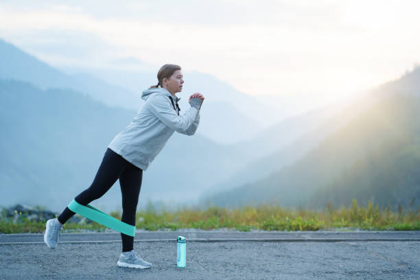 istock A woman does exercises in the mountains. 1415576159