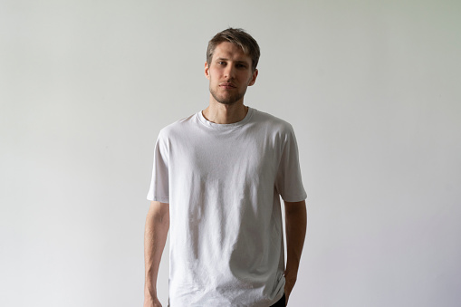 a male person in white blank shirt, mockup template