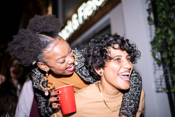 istock Happy lesbian couple having fun at night 1415578780