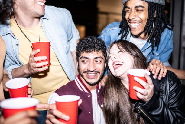 istock Friends having fun outdoors at night 1415579377