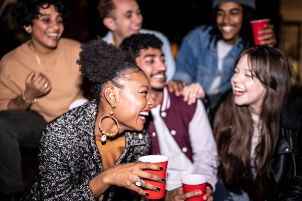 istock Friends having fun outdoors at night 1415579395