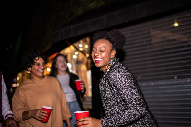 istock Friends having fun outdoors at night 1415579481