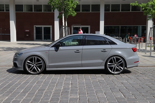 Audi RS3 high performance car in trendy Nardo Grey color parked in Germany. There were 45.8 million cars registered in Germany (as of 2017).