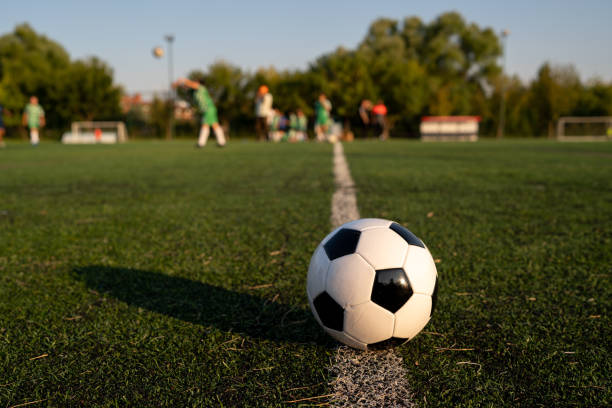 istock soccer ball on the grass 1415579943