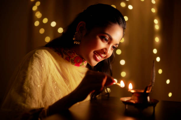 beautiful hindu indian young women lightening deepa - tamil imagens e fotografias de stock