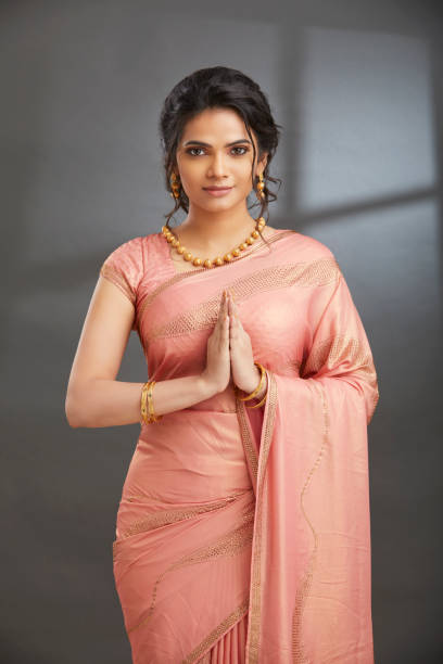 istock Beautiful Indian girl greeting 1415580014