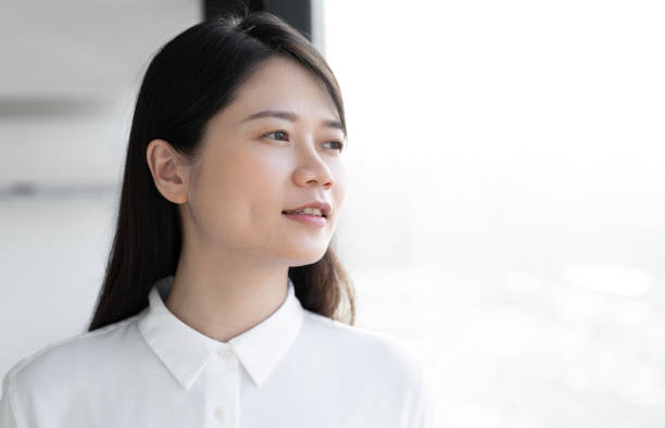 istock Asian woman in white shirt 1415580070