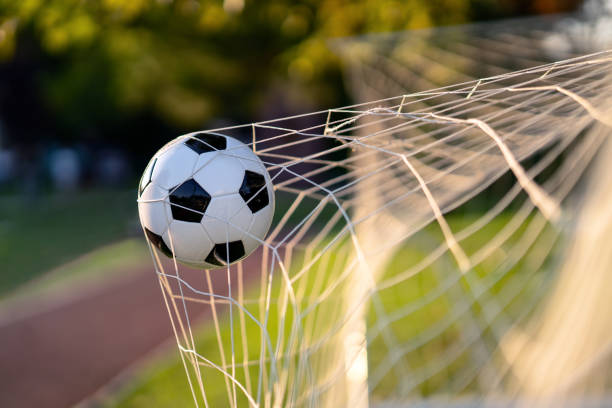 Soccer ball in goal Soccer ball in goal scoring a goal stock pictures, royalty-free photos & images