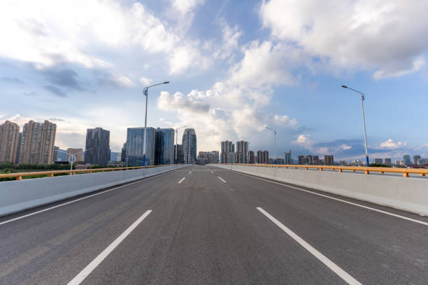 istock Empty urban road and modern urban buildings 1415581407
