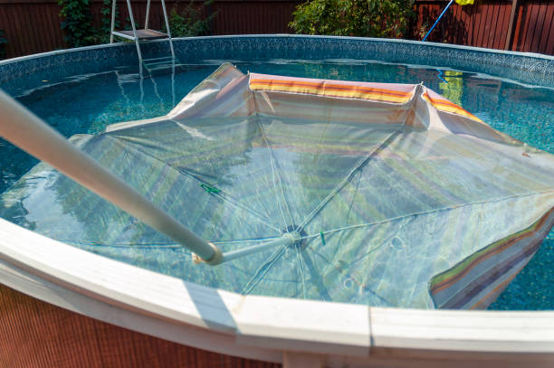 istock sun umbrella in the swimming pool 1415582463