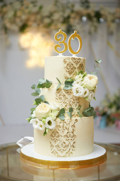 istock Three-tiered cake with flowers for 30th anniversary 1415585037