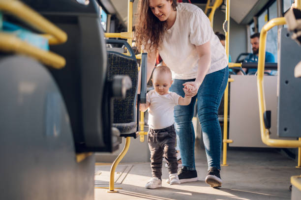 istock Mother and her child riding in a bus during a day. 1415585905