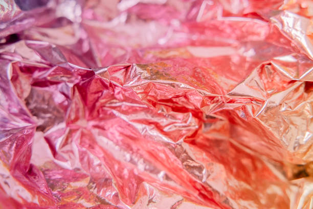 istock Iridescent foil texture background. Holographic wrinkled surface. Vibrant gradient template for design. 1415586892