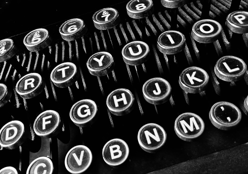 writer's workplace - wooden desk with vintage typewriter