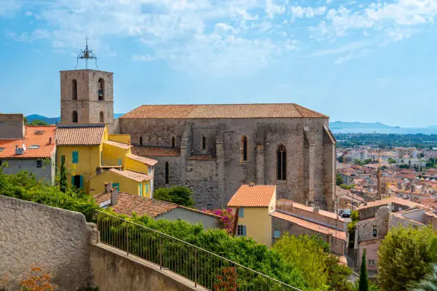 Exterior view of the Saint-Paul Collegiate Church (Collégiale Saint-Paul), a 12th century Roman style church overlooking the old town of Hyères, France, in the French department of Var, in Provence-Alpes-Côte-d'Azur region