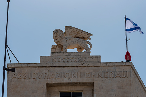 The winged lion statue Lion of Judah or the Lion of Saint Mark on the roof top of Generali Building in Jerusalem, Israel.
