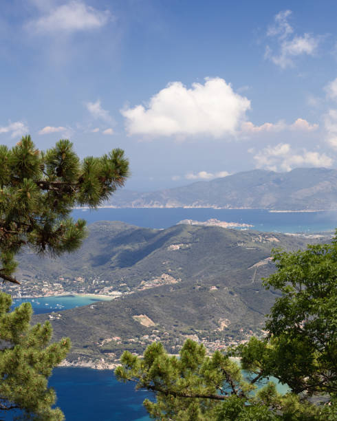 istock Panoramic vertical view of Elba island landscape shaped by mountains covered with cedar forests, and clear waters of bays and lagoons. Island of Elba, Italy 1415591773