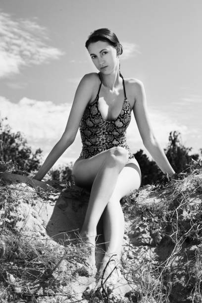 istock slim woman sunbathes 1415594343