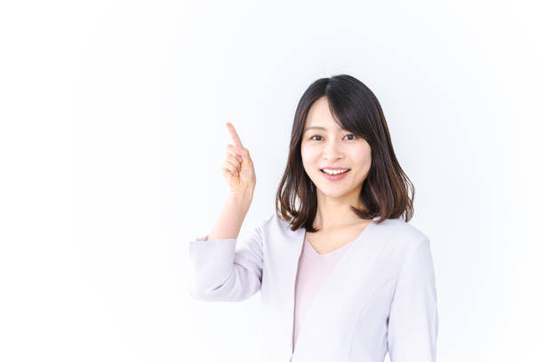 istock Career woman pointing with a smile 1415595647