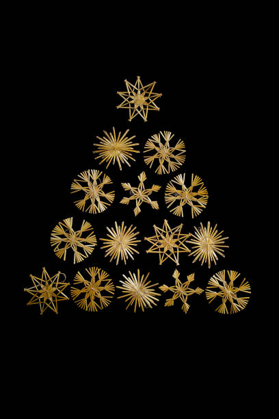 istock Christmas tree triangle made with straw snowflakes isolated 1415597735