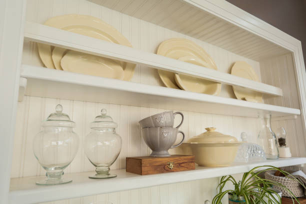 istock Vintage kitchen decorated with plates, glass kitchen items, mugs and plants. 1415599216