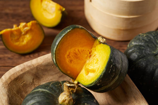 istock Some babe pumpkins on wooden table top 1415599546