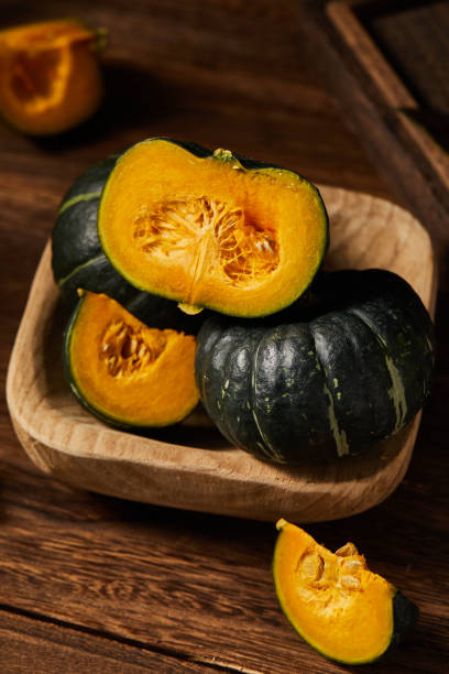 istock Some babe pumpkins on wooden table top 1415599547
