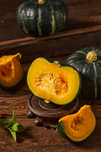 istock Some babe pumpkins on wooden table top 1415599586