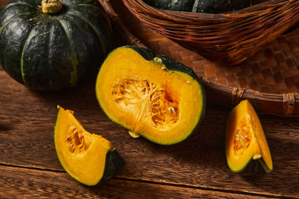 istock Some babe pumpkins on wooden table top 1415599692