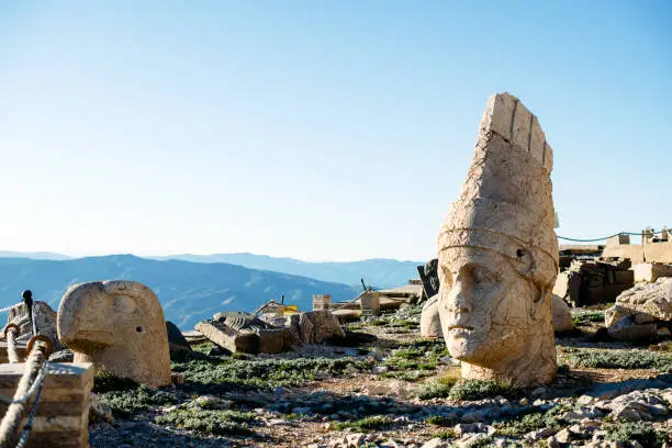 Heads of the statues on Nemrut Dag on the sunset. Travel concept photo. Adiyaman, Nemrut Mountain, Turkey