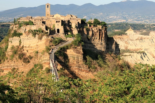 ‎The citadel of Civita di Bagnoregio‎‎ is located on the top of a remarkable hill and offers itself an incomparable spectacle to those who observe it from the panoramic points of Bagnoregio.‎ ‎The wonderful village of Civita di Bagnoregio‎‎, the so-called ‎‎Civita that dies‎‎ is a very small town where time seems to have stopped and where you can only reach it on foot, along a reinforced concrete bridge built for the benefit of the few remaining citizens and tourists ‎‎who visit it from all over the world.‎
‎The charming medieval village, known throughout the world as 