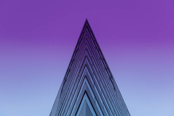 Pyramidal office building Toned image of exterior of pyramidal office building pointy building stock pictures, royalty-free photos & images