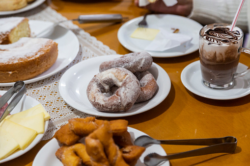 Breakfast table with various pastries and cakes