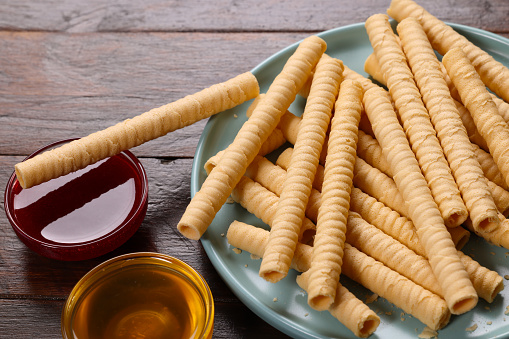 Wafer Tubes a sweet snack with Honey and Strawberry Jam dip
