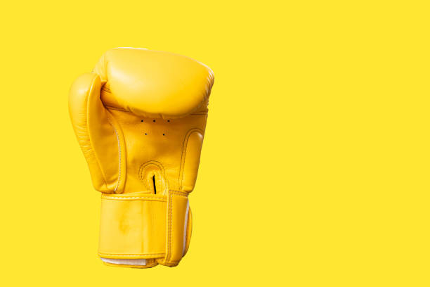 istock yellow boxing gloves isolated background. 1415611692