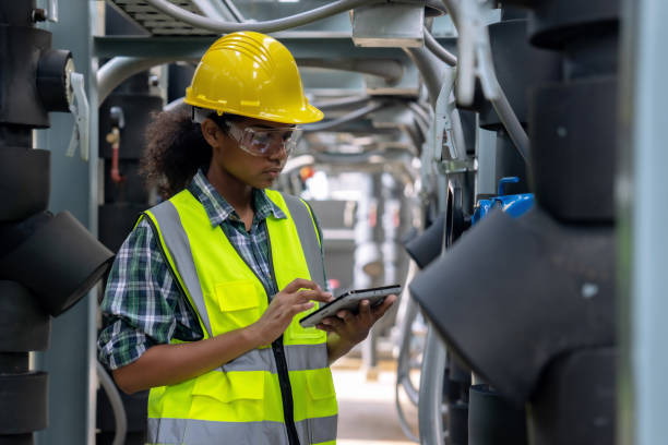 istock Engineer checking the cooling system of the factory air conditioner. 1415613664