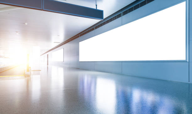 istock Blank billboard and escalator at a international airport 1415614928