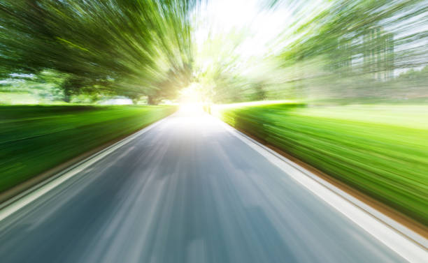 istock Empty road in the jungle with motion blur 1415614984