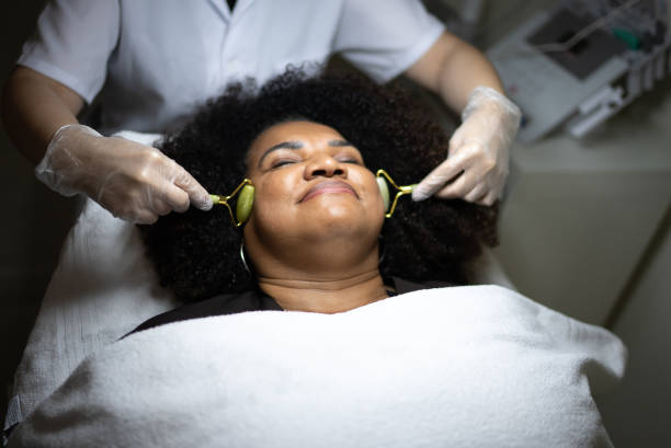 istock Mature woman receiving massage with gemstone rollers at beauty spa 1415615005