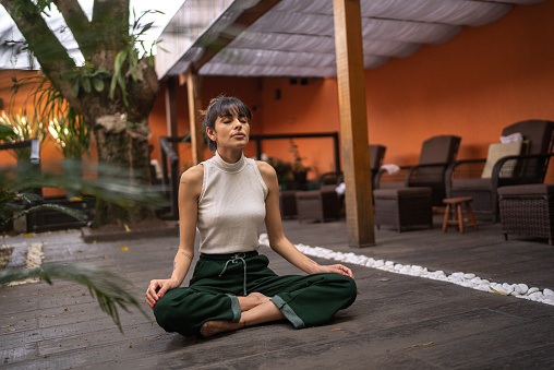 Young woman meditating in a spa