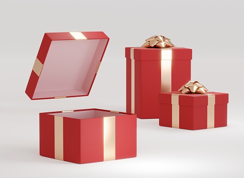 Large gift boxes with a bow on a red background