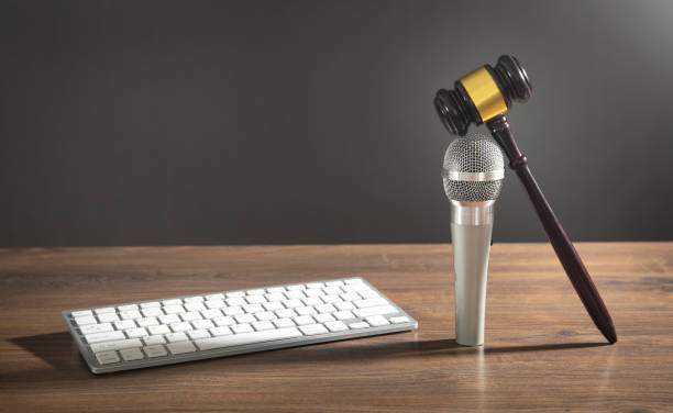 istock Judge gavel, microphone and computer keyboard. Concept of Auction 1415617925