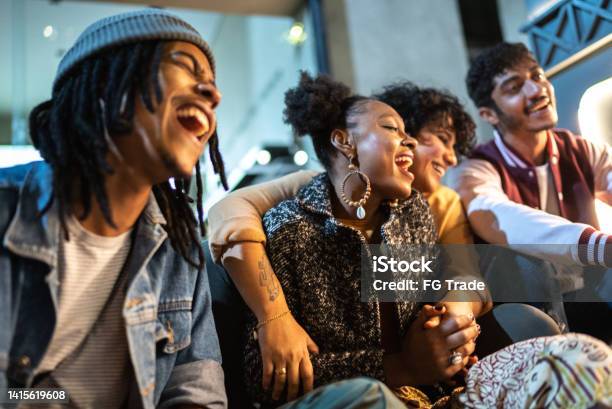 Friends Having Fun Outdoors At Night Stock Photo - Download Image Now - Gratitude, Black People, LGBTQIA Culture