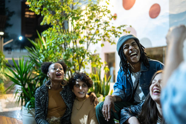istock Friends having fun outdoors at night 1415619828