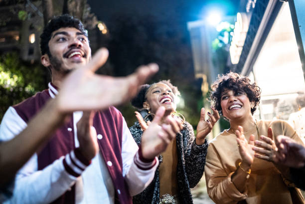 istock Friends having fun outdoors at night 1415621141