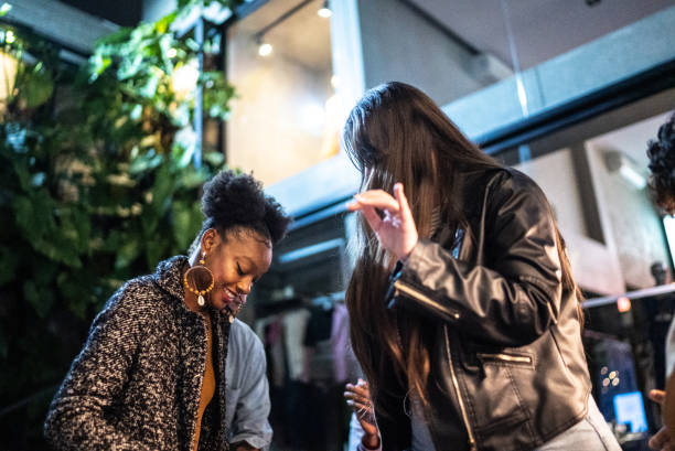 istock Group of friends dancing outside at night 1415621143
